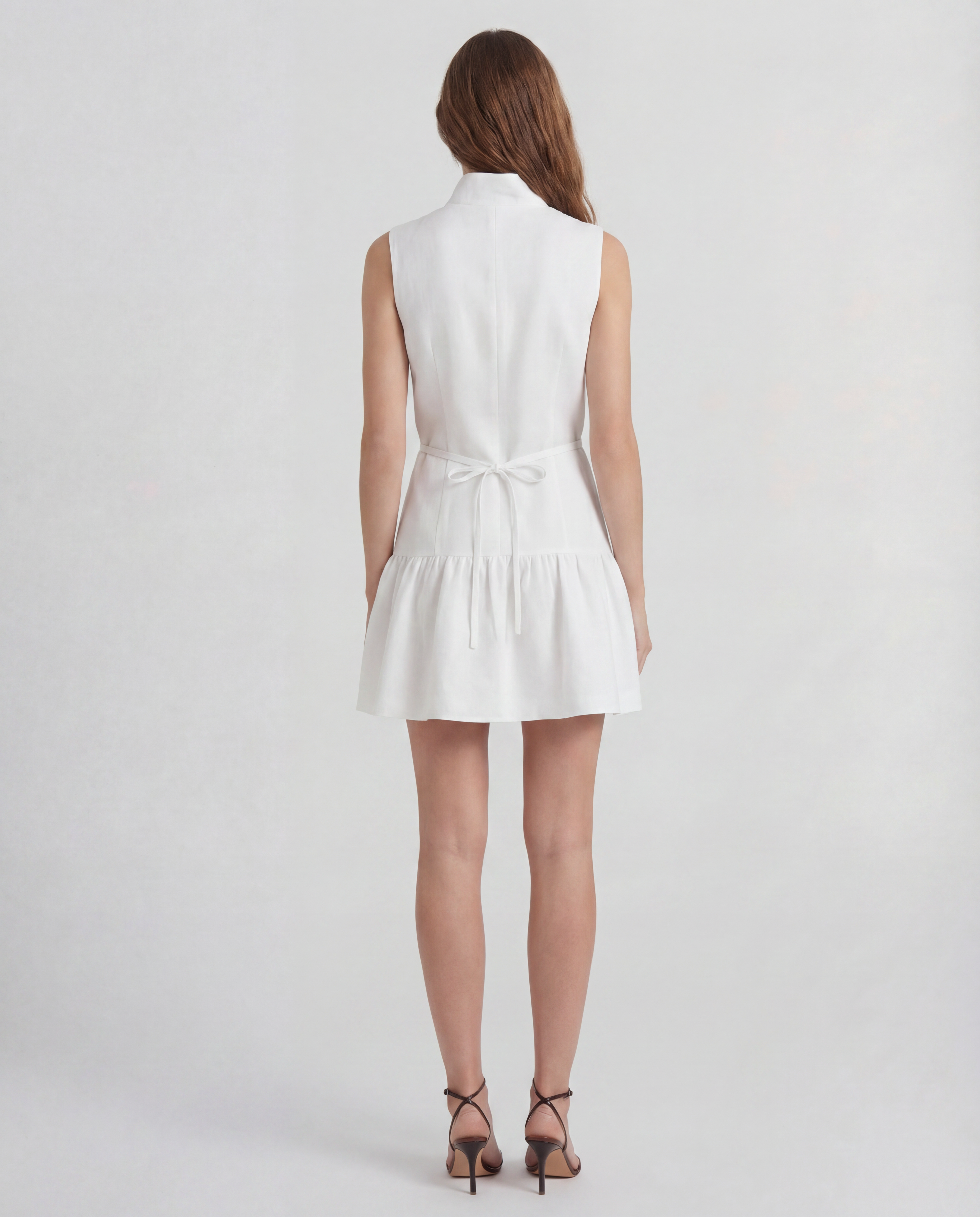 Paris Dress in linen with a structured peplum silhouette