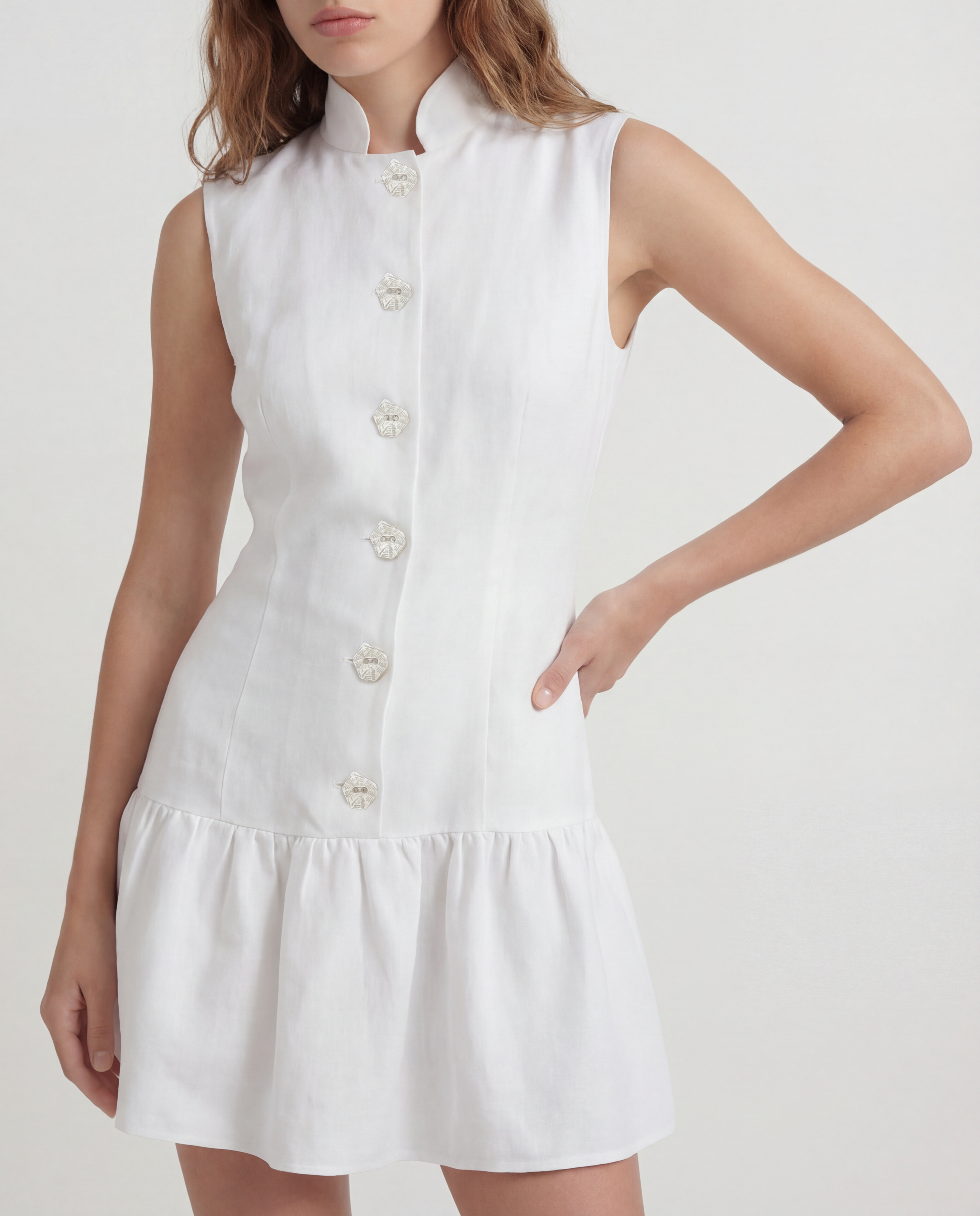 Paris Dress in linen with a structured peplum silhouette