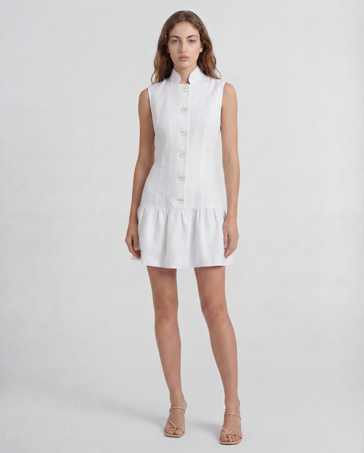Paris dress in linen with a sculptural peplum silhouette