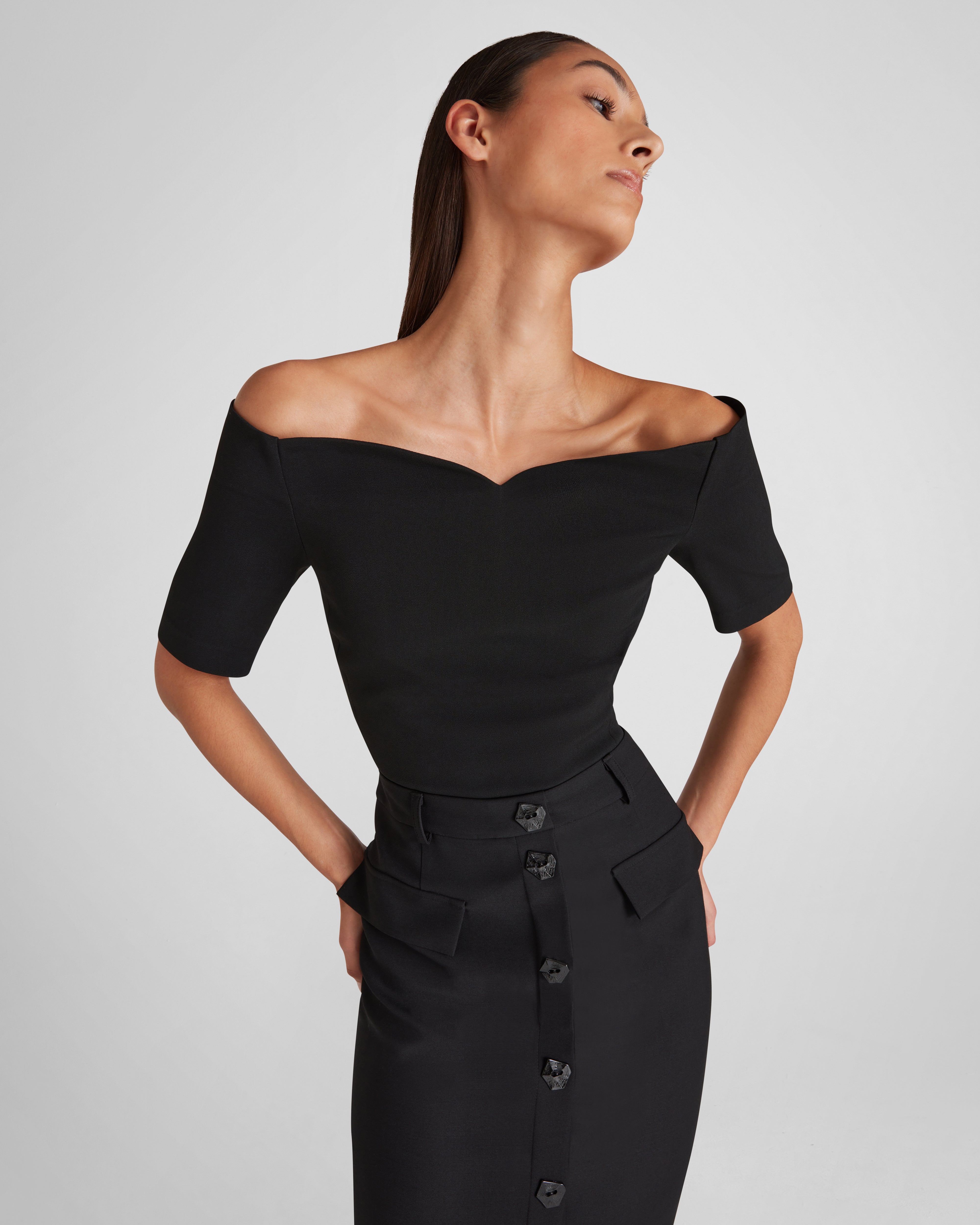 Carrisi top with a sculptural off-the-shoulder neckline