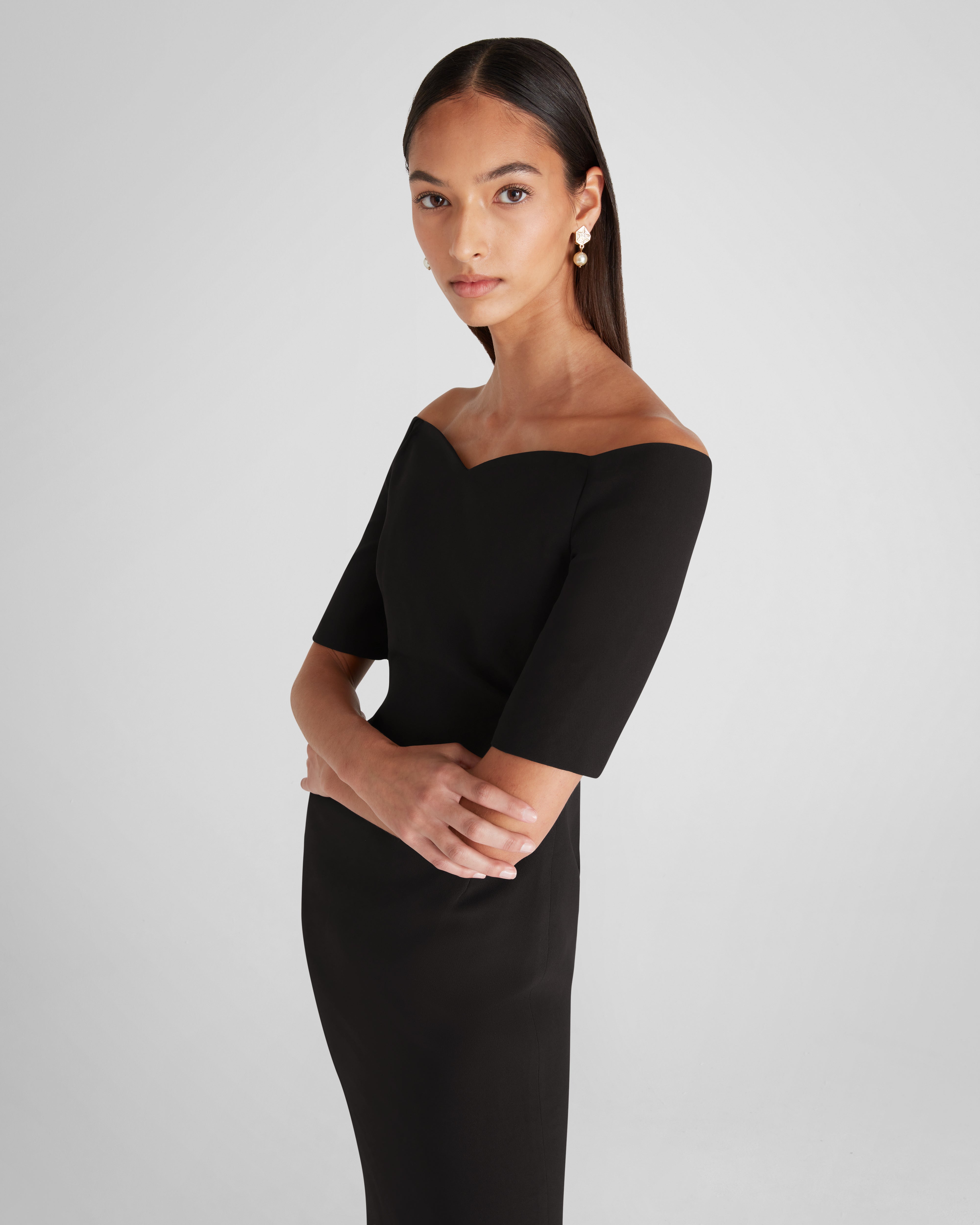 Lucretia dress with a sculptural off-the-shoulder neckline