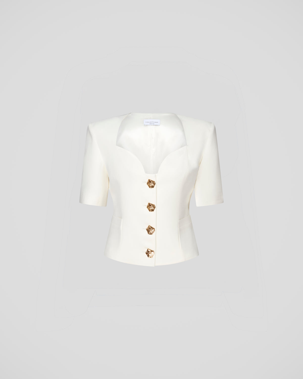 Serrier top with a sculptural neckline and padded shoulders