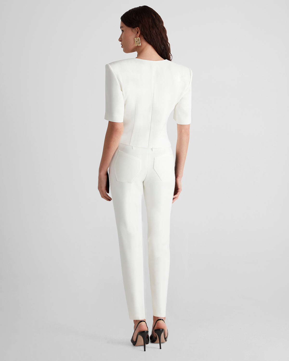 Serrier top with a sculptural neckline and padded shoulders