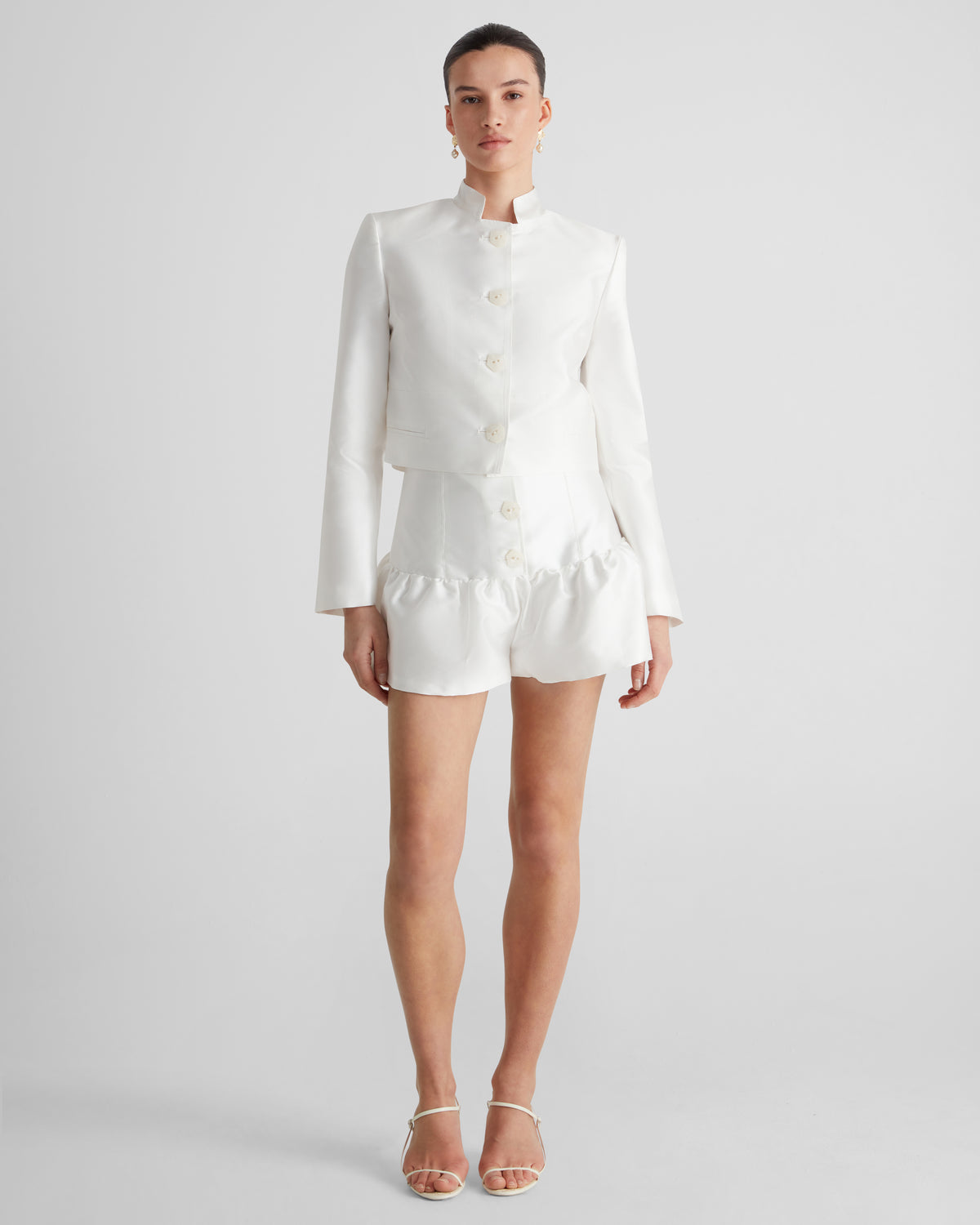 Morocco shorts in sculptural silk mikado with a peplum hem